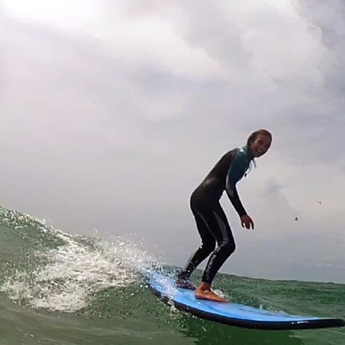 A woman enjoying a wave
